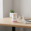 Embalagem Be-Life Anti-Stress 600 numa rotina diária com água, caderno e secretária